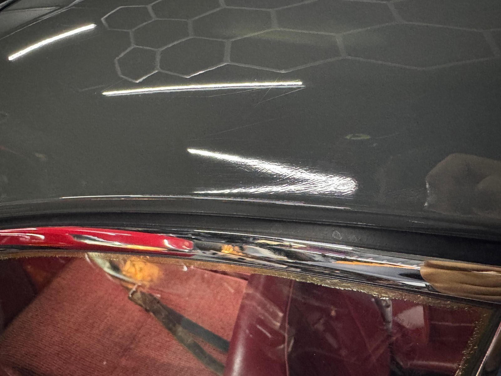Porsche 356 SC arrival — failing clear coat and surface scratches under shop lighting