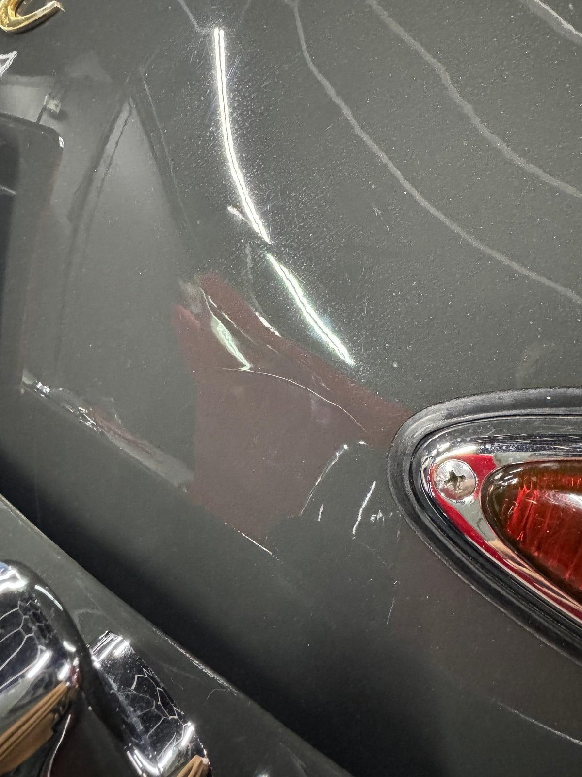 Porsche 356 SC arrival — surface damage adjacent to taillight bezel