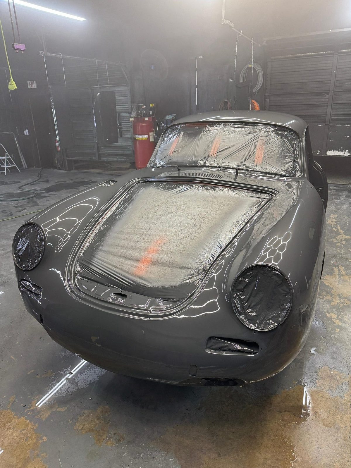 Porsche 356 SC front view fresh out of the paint booth, Slate Grey color coat wet and glossy