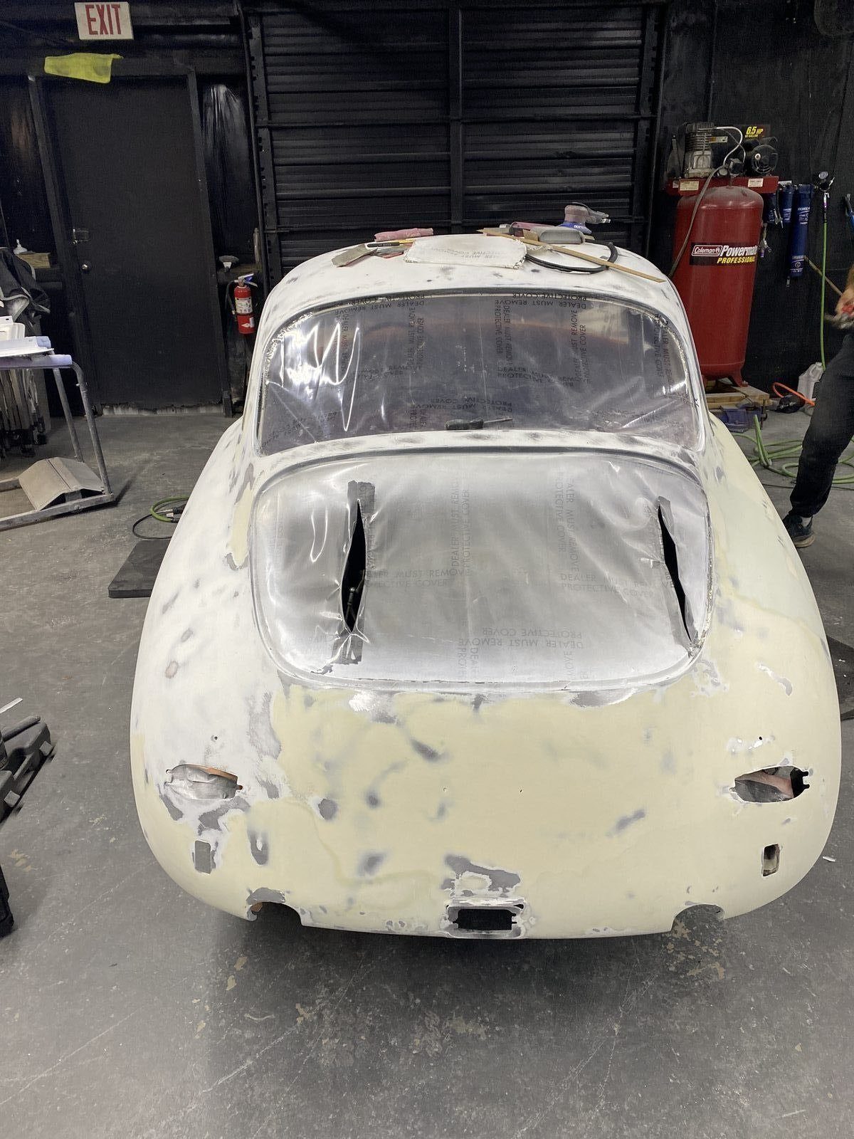 Porsche 356 SC body work — body filler applied and sanded across the rear panel