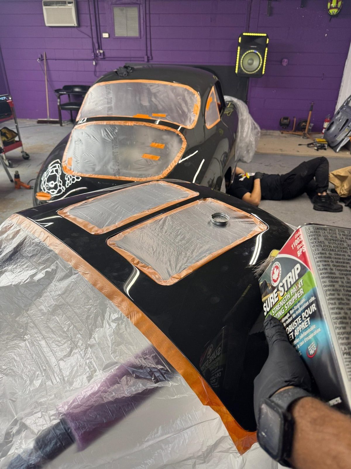 Porsche 356 SC masked with orange tape and plastic, ready for chemical paint stripper