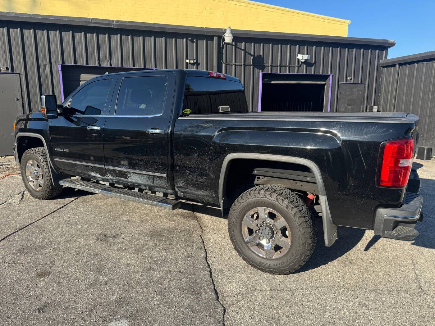 Truck under shop inspection lighting showing paint clarity